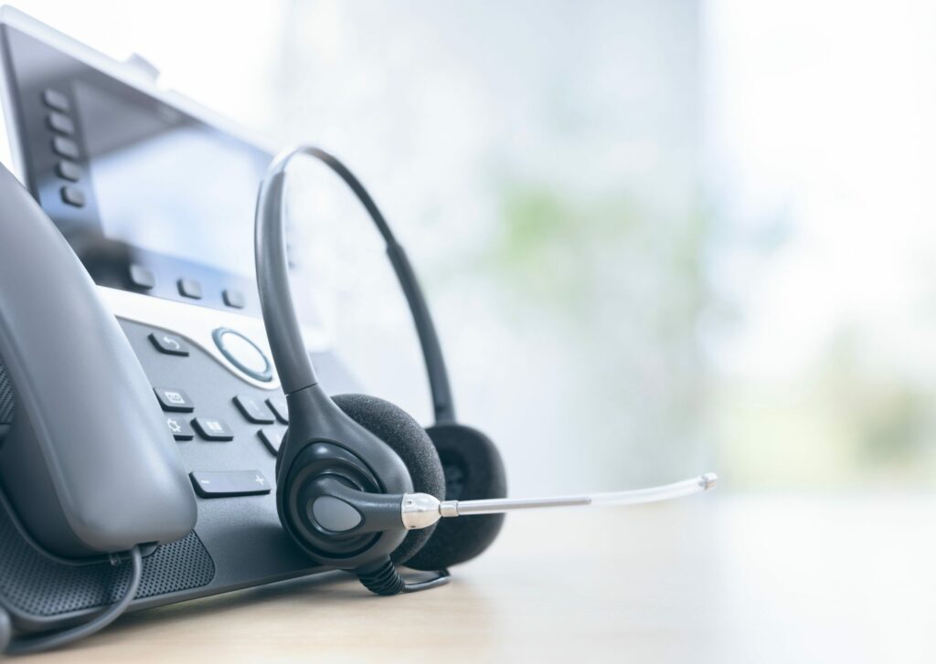 VOIP headset headphones telephone with microphone on office desk concept for communication, it support, call center and customer service help desk